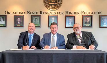 Carl Albert State College President Jay Falkner, Murray State College President Tim Faltyn and Redlands Community College President Jack Bryant signed the memorandum of understanding that outlines each institution’s role in the sharing of services of a system administrator who will maintain the colleges’ Ellucian Colleague system. 