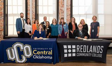 UCO and Redlands staff join UCO President Patti Neuhold-Ravikumar and Redlands President Jack Bryant in the signing of the transfer student partnership.
