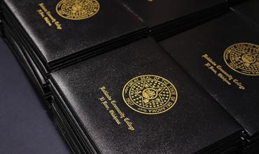 Stacks of diploma holders