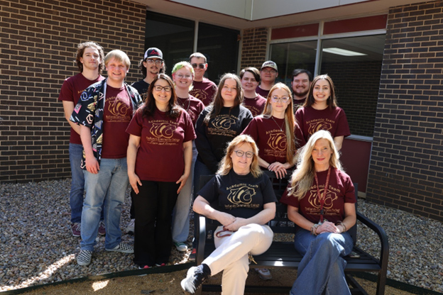 A group of people standing outside in Redlands T-Shirts