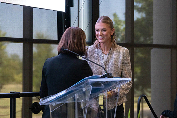Woman on stage accepting award